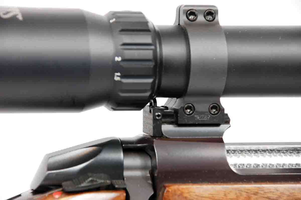 A closeup of Brockman’s innovative integral pop-up aperture sight tucked neatly below the scope just forward of the power change ring.
